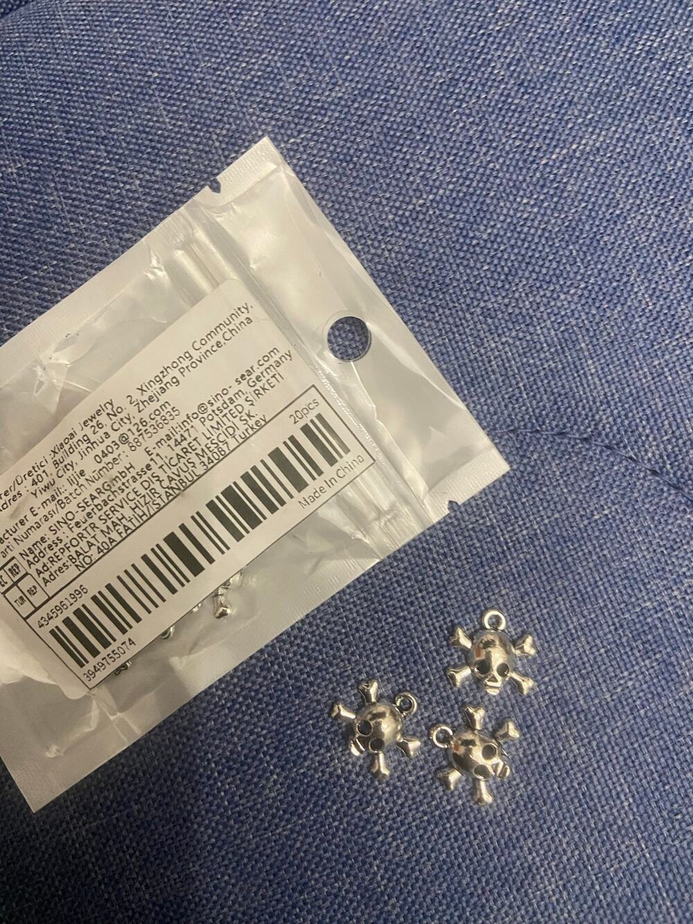 20 piece skull and cross bone charms Silvertone